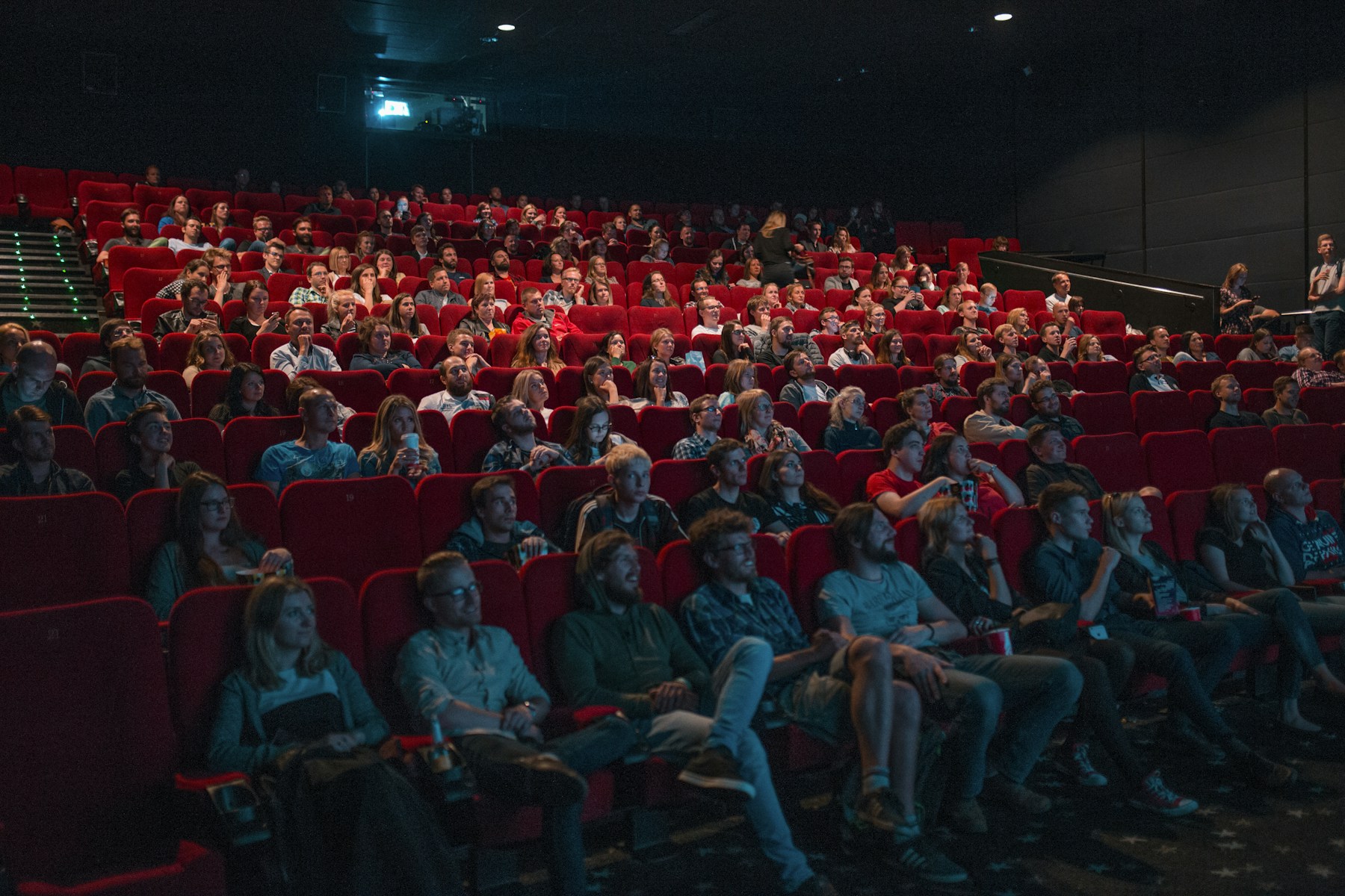 An audience watching a film together in a cinema